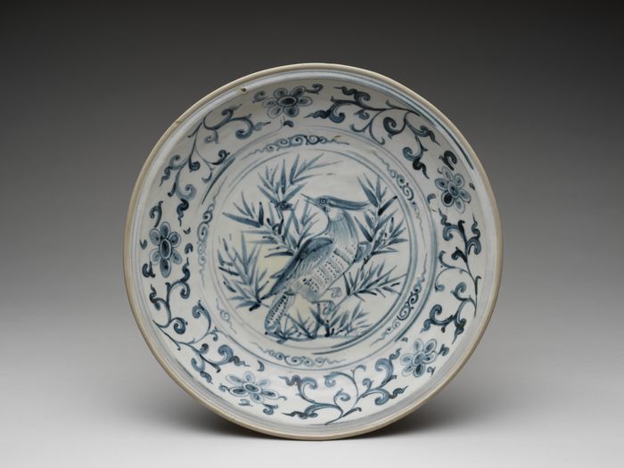 Dish with bird amid  bamboo design and foliate meander on cavetto