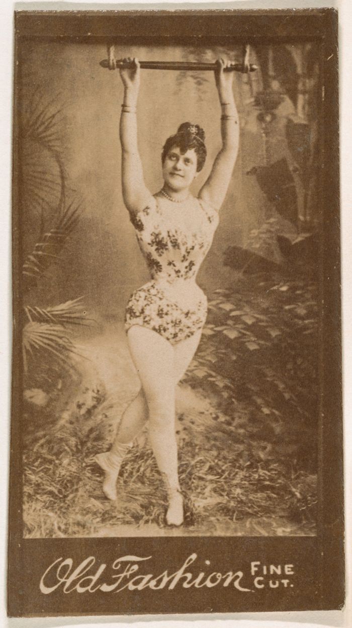 Actress holding onto metal bar above head, from the Actresses series (N664) promoting Old Fashion Fine Cut Tobacco