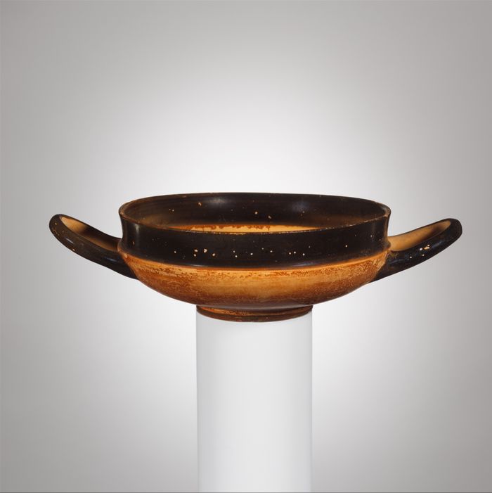 Terracotta stemless kylix (drinking cup)