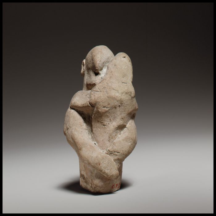 Two figures in a scene of childbirth
