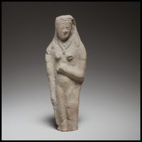 Limestone head of beardless male votary