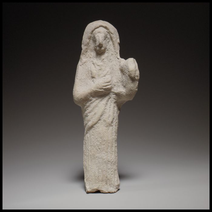 Standing female lyre player