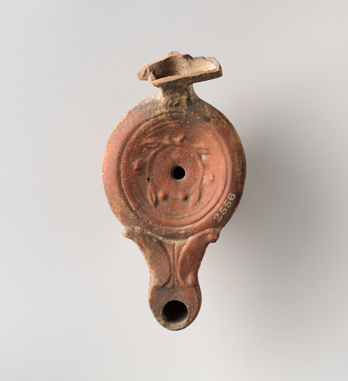Terracotta oil lamp