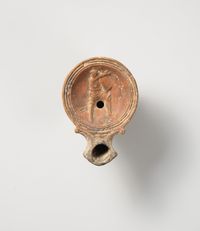 Terracotta lamp in the form of a gladiator’s helmet