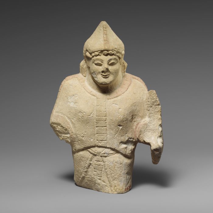 Limestone statuette of a warrior holding a shield