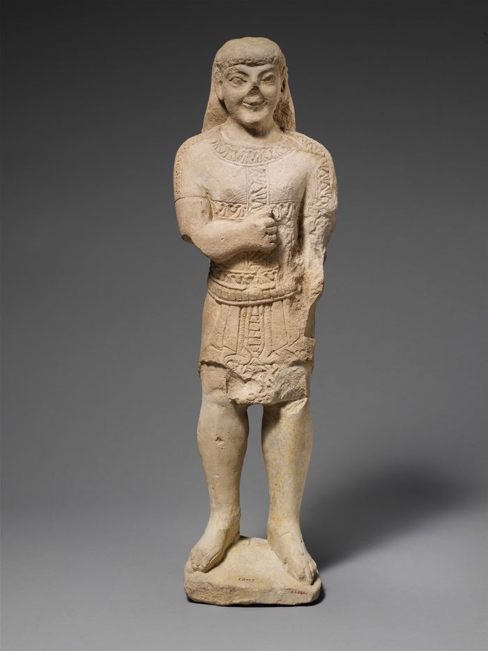 Limestone statuette of a beardless male votary in Egyptianizing dress
