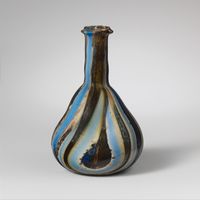 Terracotta spouted conical bowl, white-on-dark ware