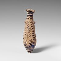 Terracotta statuette of a man holding a quadruped