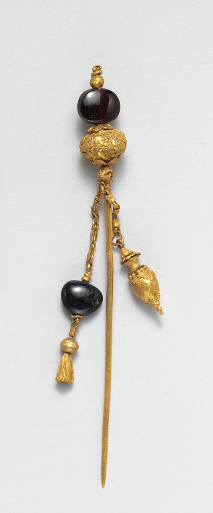 Gold and garnet pin