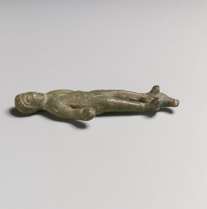 Statuette of a man with object in hand
