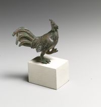 Gold finial ending in a lion's head