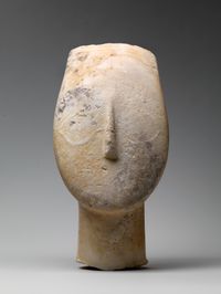 Limestone head of a wreathed youth