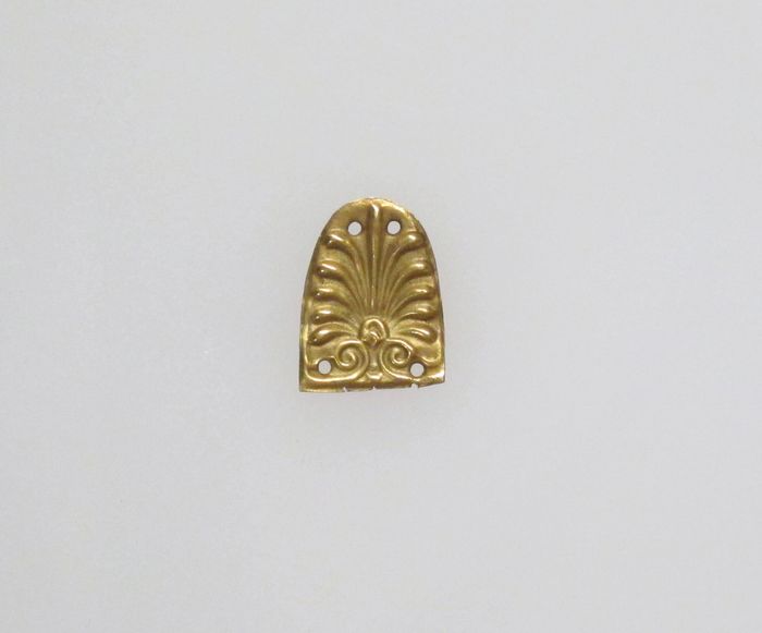 Three gold appliqués