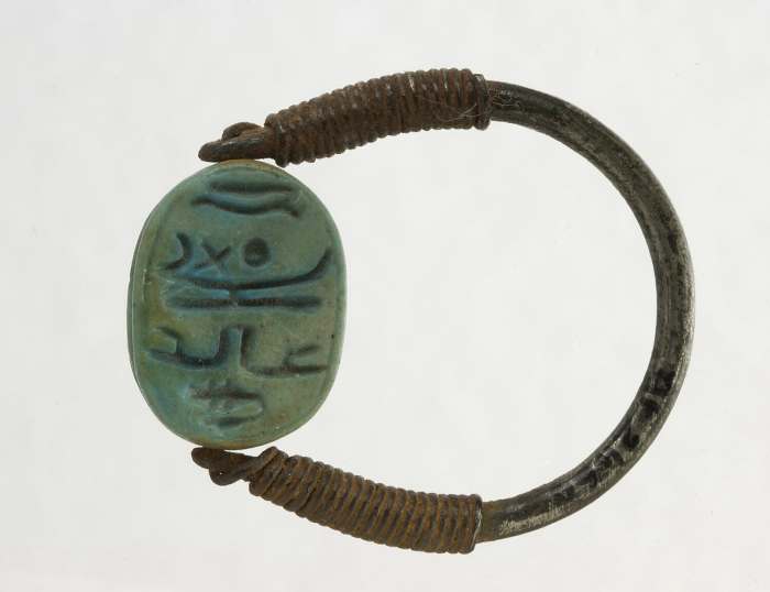 ring with rolled ends; openwork scarab