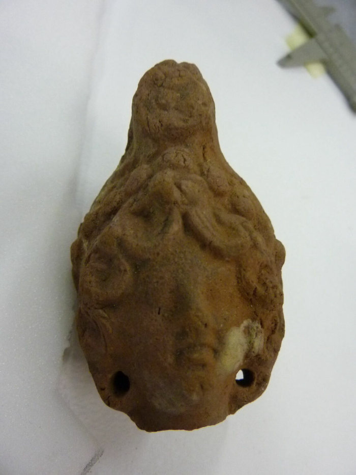 Roman female head figurine with closed neck