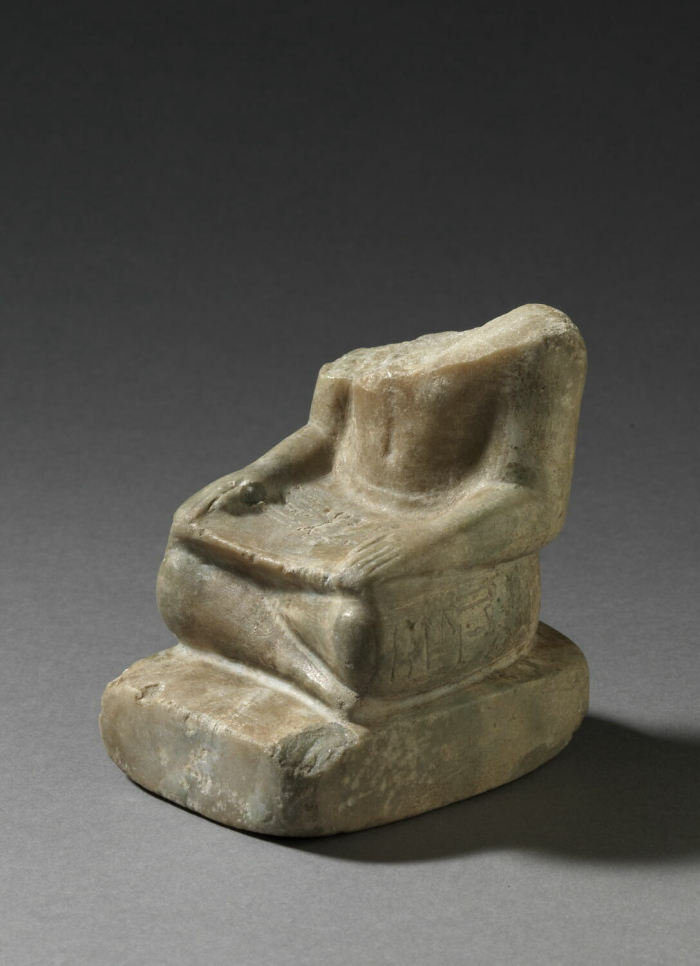 statue of a scribe sitting cross-legged